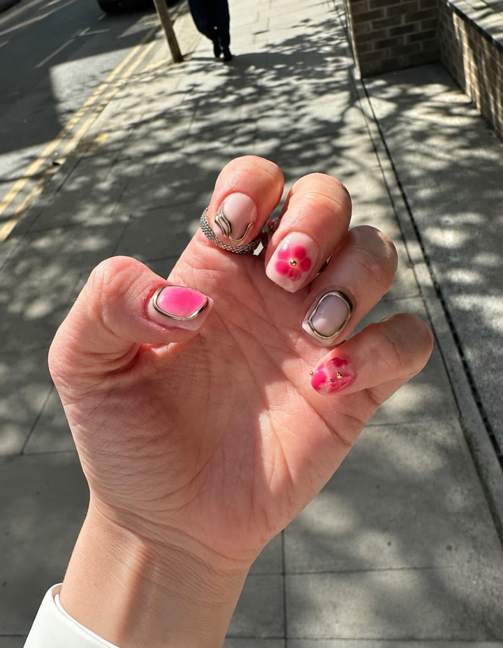 Pink floral nails with chrome silver tips